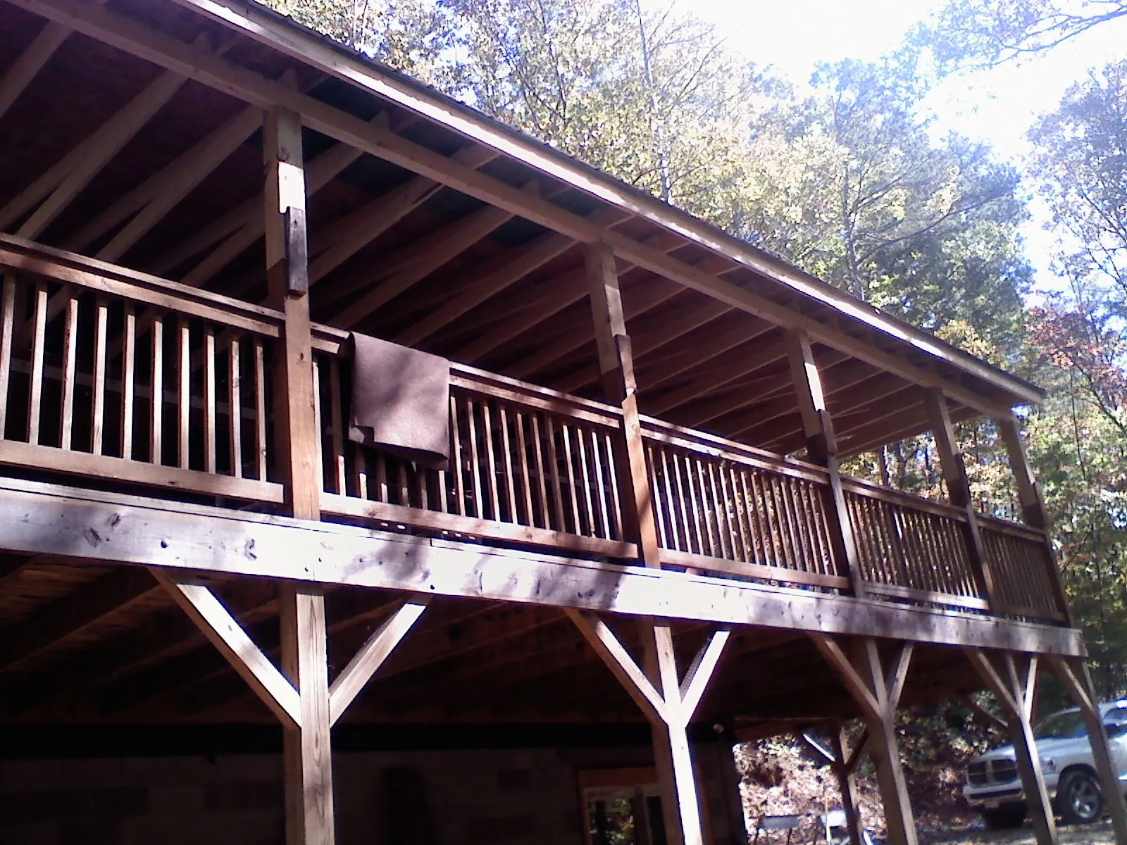 Timber framing under a new elevated porch and deck — Roof Leak Repair in Cold Spring Harbor by Roofing Brothers